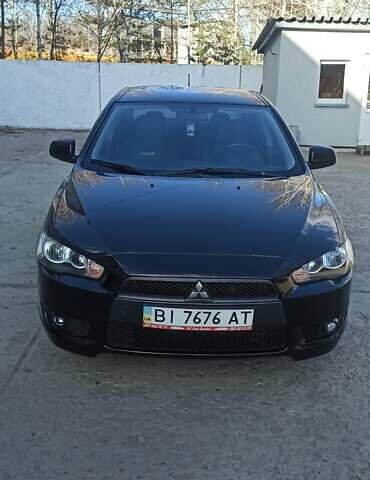 Черный Мицубиси Лансер, объемом двигателя 2 л и пробегом 315 тыс. км за 7600 $, фото 1 на Automoto.ua