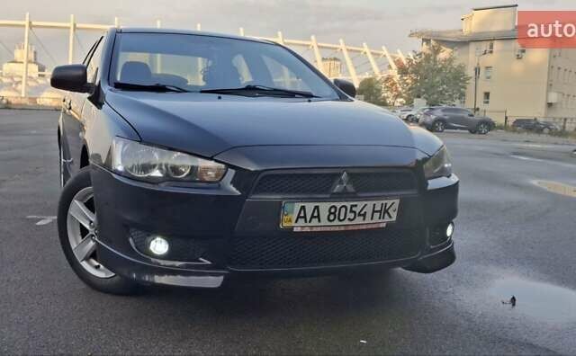 Чорний Міцубісі Lancer, об'ємом двигуна 2 л та пробігом 235 тис. км за 6500 $, фото 1 на Automoto.ua