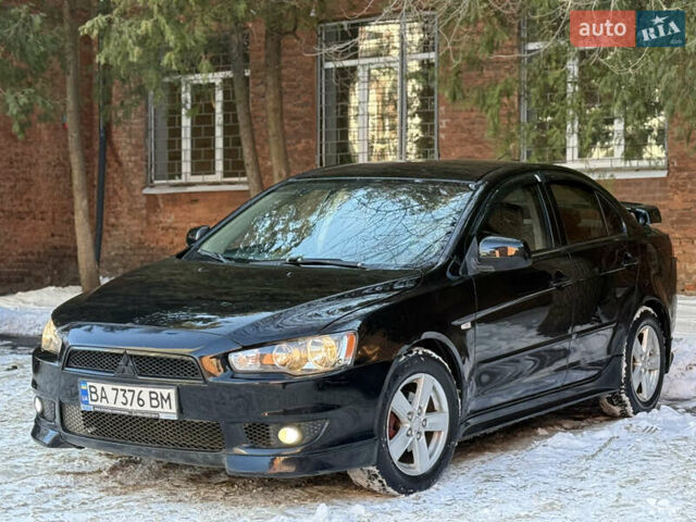 Черный Мицубиси Лансер, объемом двигателя 2 л и пробегом 200 тыс. км за 6000 $, фото 1 на Automoto.ua