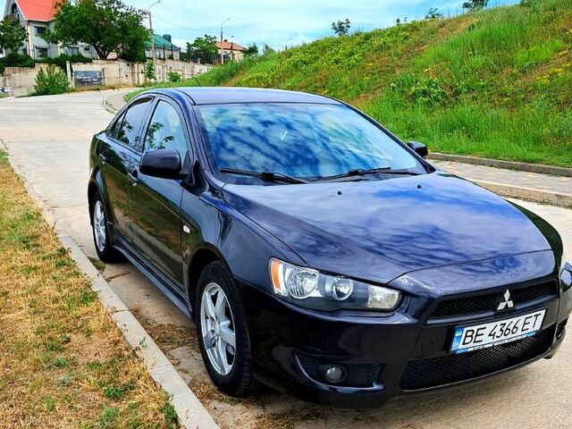 Черный Мицубиси Лансер, объемом двигателя 2 л и пробегом 347 тыс. км за 7300 $, фото 1 на Automoto.ua