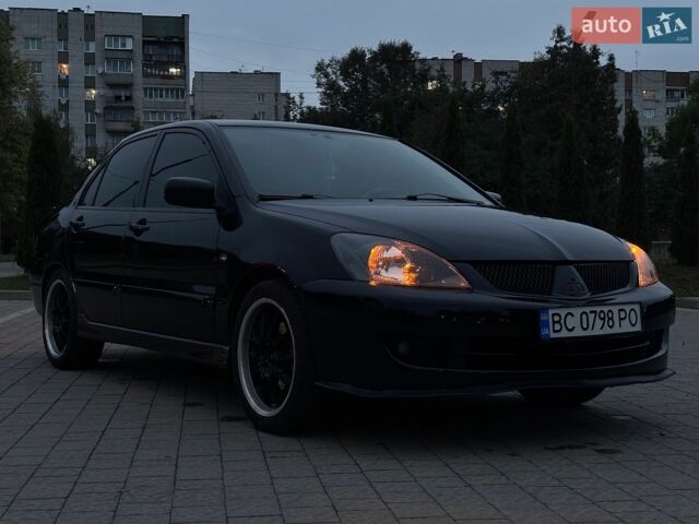 Чорний Міцубісі Lancer, об'ємом двигуна 1.58 л та пробігом 255 тис. км за 3600 $, фото 1 на Automoto.ua