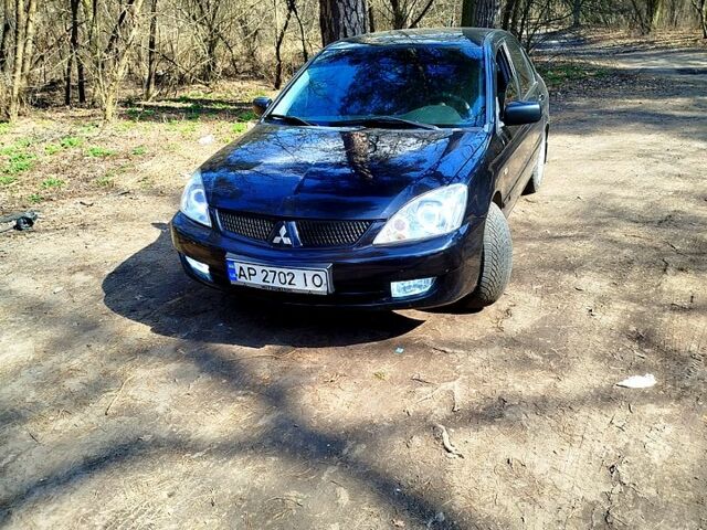 Черный Мицубиси Лансер, объемом двигателя 1.6 л и пробегом 0 тыс. км за 4500 $, фото 1 на Automoto.ua