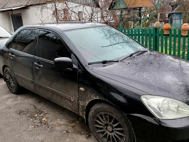 Чорний Міцубісі Lancer, об'ємом двигуна 1.6 л та пробігом 126 тис. км за 4500 $, фото 1 на Automoto.ua