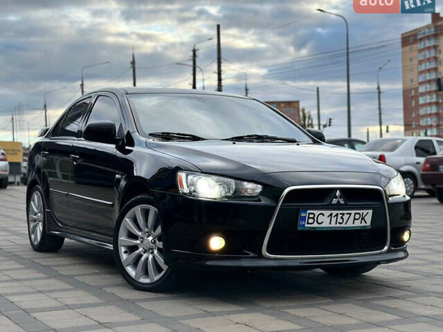 Черный Мицубиси Лансер, объемом двигателя 2 л и пробегом 236 тыс. км за 7950 $, фото 1 на Automoto.ua