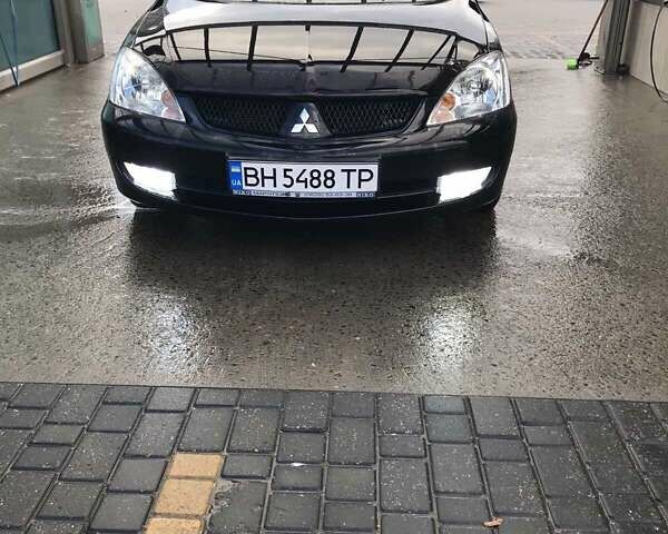 Черный Мицубиси Лансер, объемом двигателя 1.6 л и пробегом 124 тыс. км за 6500 $, фото 1 на Automoto.ua