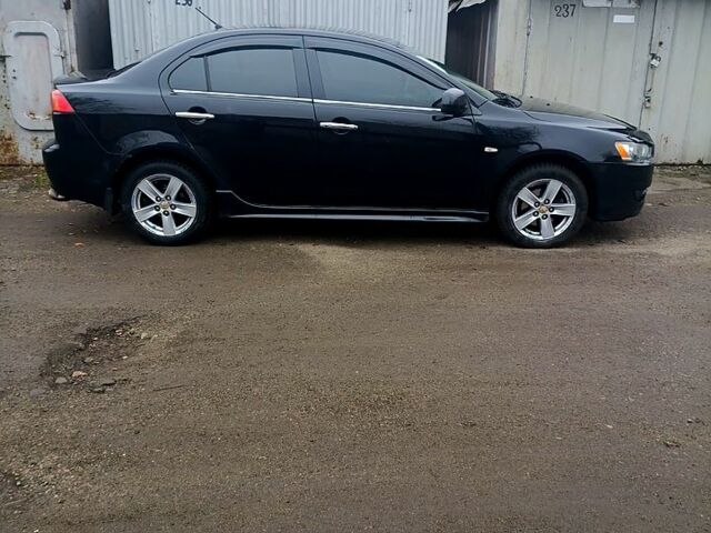 Чорний Міцубісі Lancer, об'ємом двигуна 2 л та пробігом 192 тис. км за 6350 $, фото 1 на Automoto.ua