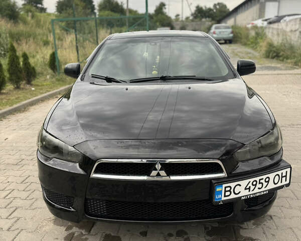 Черный Мицубиси Лансер, объемом двигателя 1.5 л и пробегом 230 тыс. км за 6000 $, фото 1 на Automoto.ua