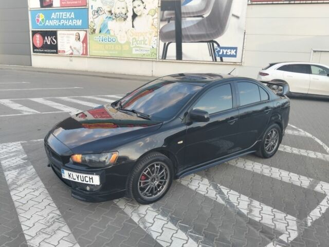 Черный Мицубиси Лансер, объемом двигателя 2 л и пробегом 248 тыс. км за 6500 $, фото 1 на Automoto.ua