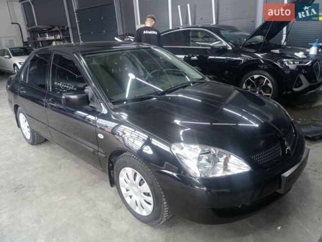 Чорний Міцубісі Lancer, об'ємом двигуна 1.58 л та пробігом 80 тис. км за 5900 $, фото 1 на Automoto.ua