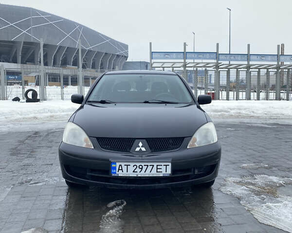 Черный Мицубиси Лансер, объемом двигателя 1.6 л и пробегом 223 тыс. км за 3700 $, фото 1 на Automoto.ua