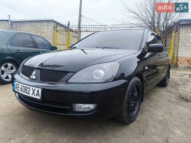 Черный Мицубиси Лансер, объемом двигателя 1.58 л и пробегом 243 тыс. км за 5600 $, фото 1 на Automoto.ua