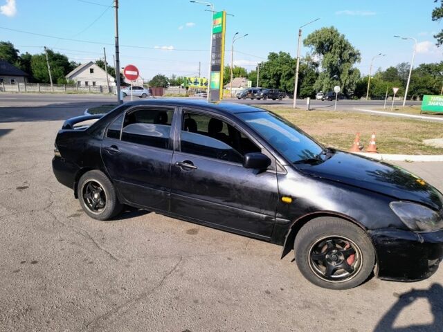 Чорний Міцубісі Lancer, об'ємом двигуна 1.6 л та пробігом 1000 тис. км за 1687 $, фото 1 на Automoto.ua