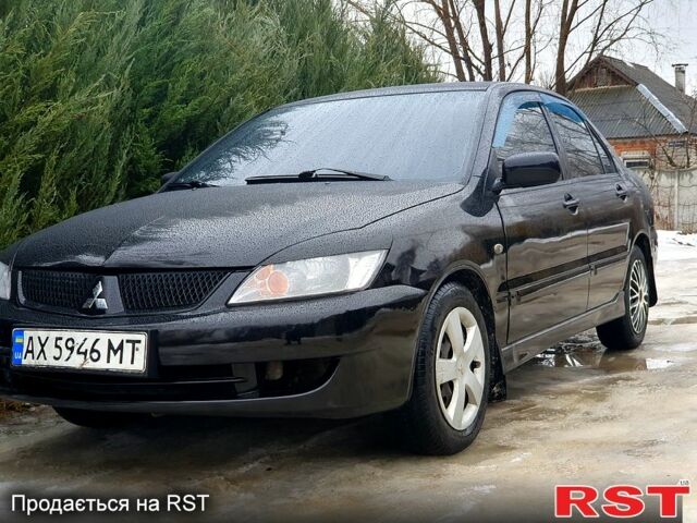 Черный Мицубиси Лансер, объемом двигателя 1.6 л и пробегом 37000 тыс. км за 4000 $, фото 1 на Automoto.ua