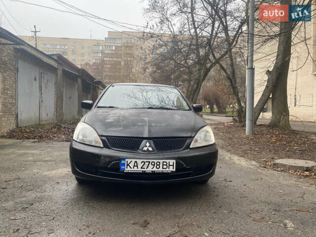 Черный Мицубиси Лансер, объемом двигателя 1.6 л и пробегом 143 тыс. км за 3000 $, фото 1 на Automoto.ua