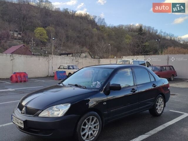 Черный Мицубиси Лансер, объемом двигателя 1.6 л и пробегом 274 тыс. км за 3800 $, фото 1 на Automoto.ua