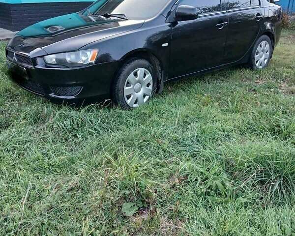 Черный Мицубиси Лансер, объемом двигателя 1.5 л и пробегом 280 тыс. км за 6200 $, фото 1 на Automoto.ua