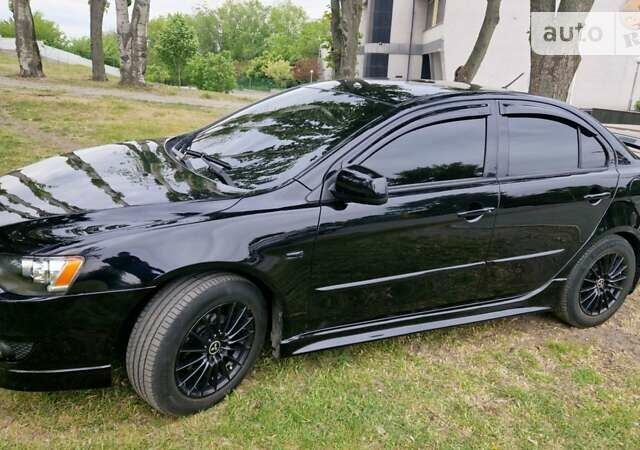 Чорний Міцубісі Lancer, об'ємом двигуна 2 л та пробігом 190 тис. км за 8000 $, фото 1 на Automoto.ua