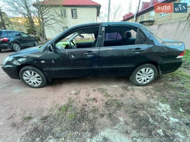 Черный Мицубиси Лансер, объемом двигателя 1.6 л и пробегом 105 тыс. км за 1700 $, фото 1 на Automoto.ua