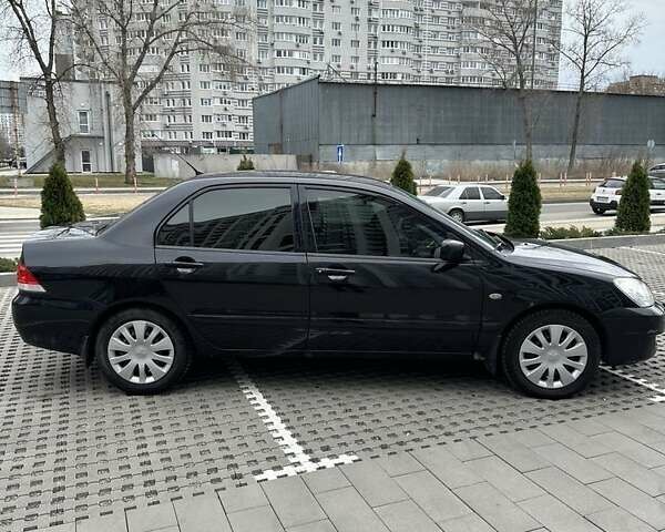 Черный Мицубиси Лансер, объемом двигателя 1.6 л и пробегом 415 тыс. км за 4100 $, фото 1 на Automoto.ua