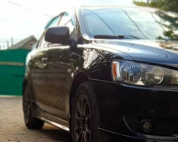 Чорний Міцубісі Lancer, об'ємом двигуна 2 л та пробігом 213 тис. км за 6200 $, фото 1 на Automoto.ua