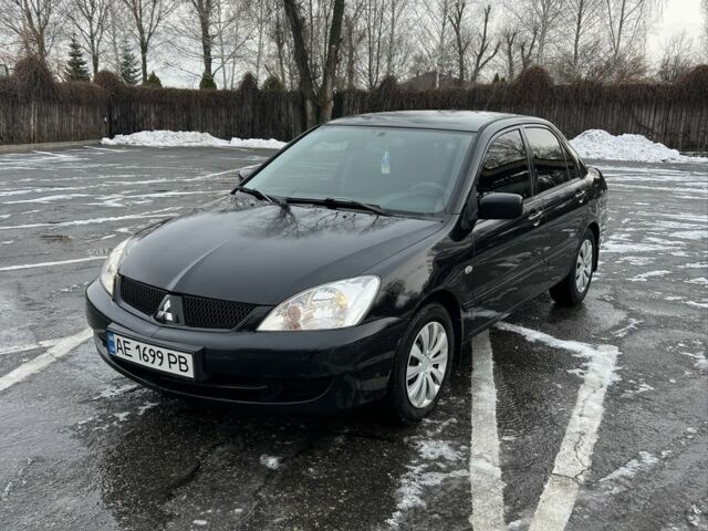 Черный Мицубиси Лансер, объемом двигателя 1.6 л и пробегом 219 тыс. км за 4300 $, фото 1 на Automoto.ua