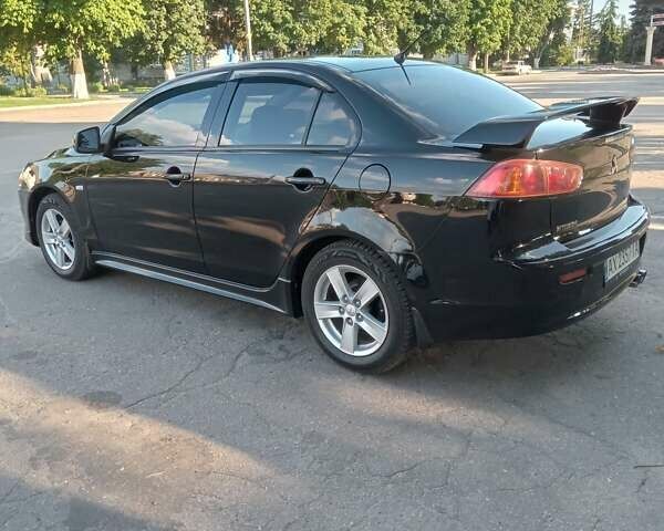 Черный Мицубиси Лансер, объемом двигателя 2 л и пробегом 198 тыс. км за 8500 $, фото 1 на Automoto.ua