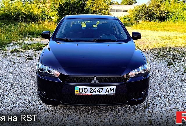 Черный Мицубиси Лансер, объемом двигателя 2 л и пробегом 20400 тыс. км за 6700 $, фото 1 на Automoto.ua