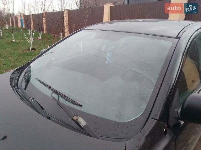 Черный Мицубиси Лансер, объемом двигателя 1 л и пробегом 400 тыс. км за 4700 $, фото 1 на Automoto.ua