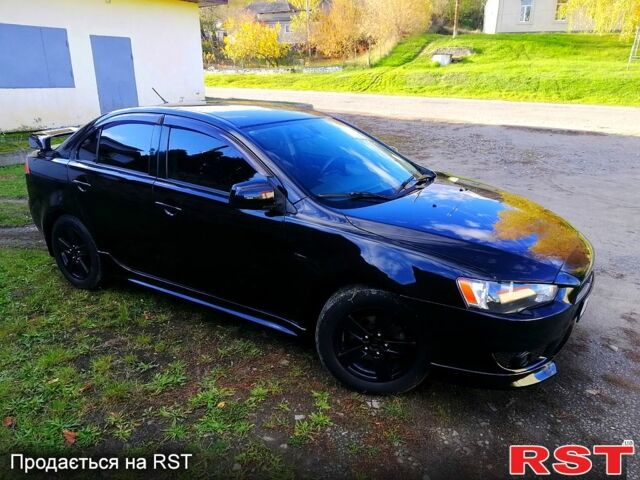 Черный Мицубиси Лансер, объемом двигателя 2 л и пробегом 196 тыс. км за 5500 $, фото 1 на Automoto.ua