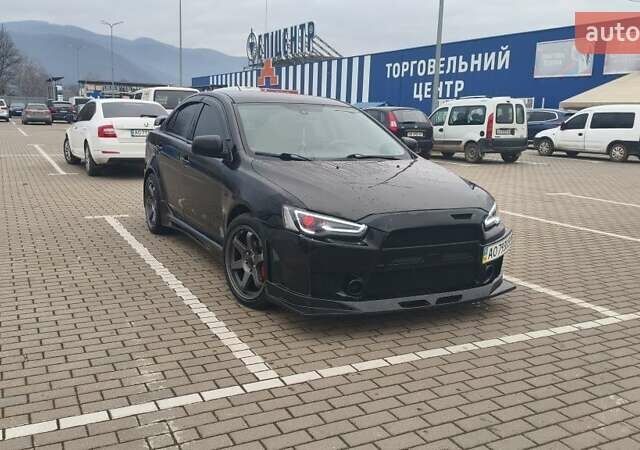 Чорний Міцубісі Lancer, об'ємом двигуна 2 л та пробігом 160 тис. км за 8000 $, фото 1 на Automoto.ua