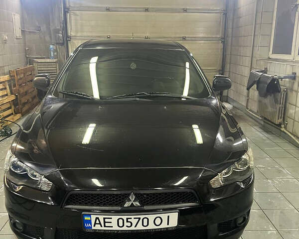 Черный Мицубиси Лансер, объемом двигателя 2 л и пробегом 200 тыс. км за 8000 $, фото 1 на Automoto.ua