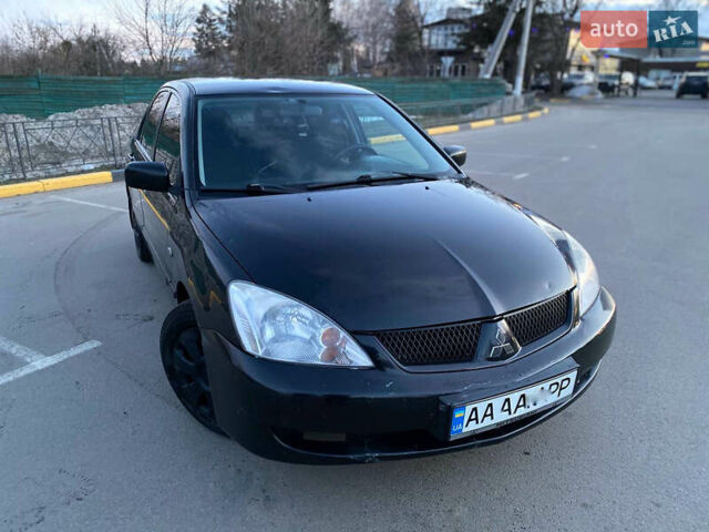 Чорний Міцубісі Lancer, об'ємом двигуна 1.58 л та пробігом 327 тис. км за 4000 $, фото 1 на Automoto.ua
