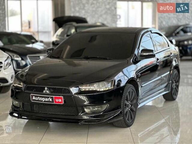 Чорний Міцубісі Lancer, об'ємом двигуна 2 л та пробігом 313 тис. км за 7690 $, фото 1 на Automoto.ua