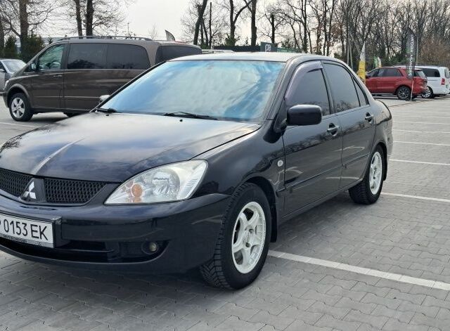 Черный Мицубиси Лансер, объемом двигателя 1.6 л и пробегом 210 тыс. км за 4000 $, фото 1 на Automoto.ua