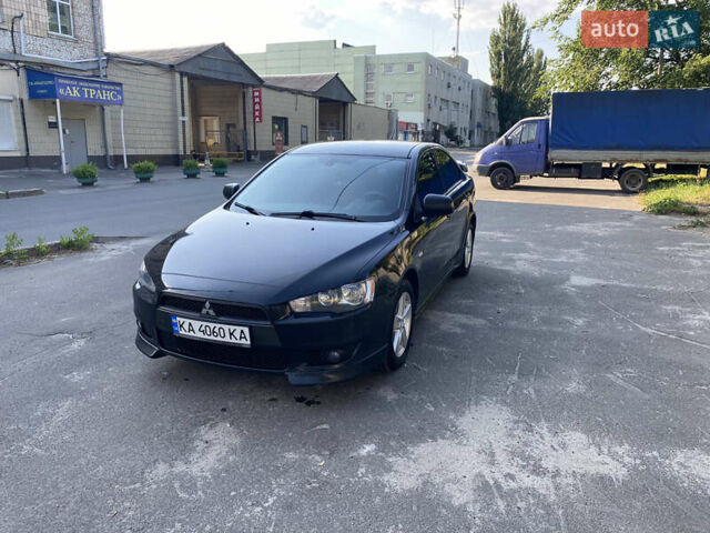 Черный Мицубиси Лансер, объемом двигателя 2 л и пробегом 240 тыс. км за 5700 $, фото 1 на Automoto.ua