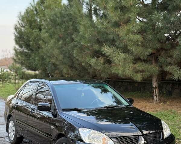 Чорний Міцубісі Lancer, об'ємом двигуна 1.6 л та пробігом 98 тис. км за 5600 $, фото 1 на Automoto.ua