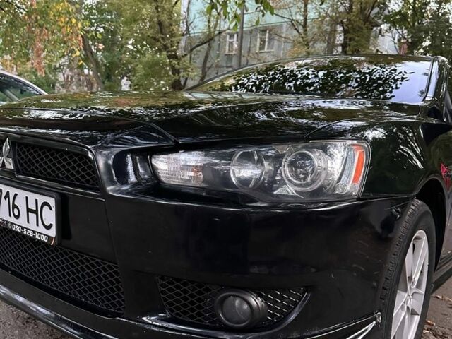 Чорний Міцубісі Lancer, об'ємом двигуна 2 л та пробігом 253 тис. км за 7300 $, фото 1 на Automoto.ua