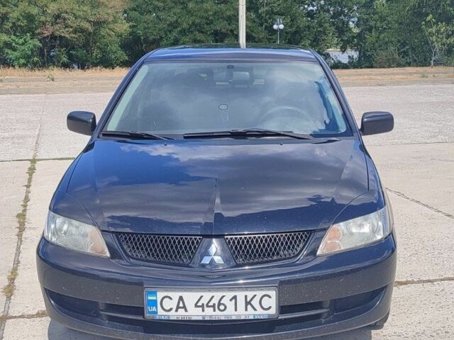 Черный Мицубиси Лансер, объемом двигателя 1.58 л и пробегом 138 тыс. км за 5500 $, фото 1 на Automoto.ua