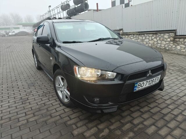 Черный Мицубиси Лансер, объемом двигателя 2 л и пробегом 228 тыс. км за 7000 $, фото 1 на Automoto.ua