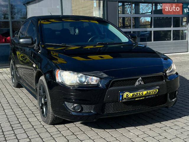 Черный Мицубиси Лансер, объемом двигателя 2 л и пробегом 215 тыс. км за 7000 $, фото 1 на Automoto.ua