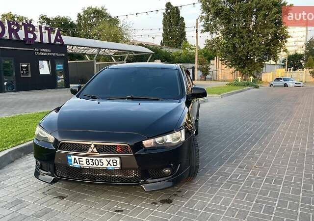 Черный Мицубиси Лансер, объемом двигателя 2 л и пробегом 185 тыс. км за 6500 $, фото 1 на Automoto.ua