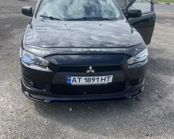 Черный Мицубиси Лансер, объемом двигателя 2 л и пробегом 201 тыс. км за 7000 $, фото 1 на Automoto.ua