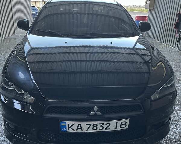 Черный Мицубиси Лансер, объемом двигателя 2 л и пробегом 280 тыс. км за 7000 $, фото 1 на Automoto.ua