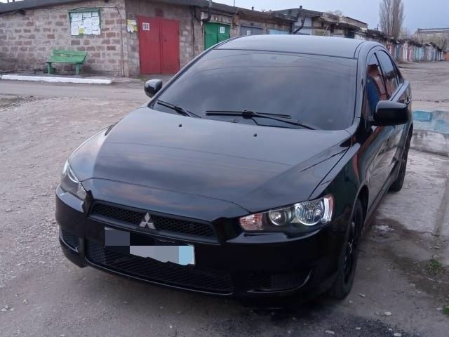 Чорний Міцубісі Lancer, об'ємом двигуна 1.5 л та пробігом 176 тис. км за 6500 $, фото 1 на Automoto.ua