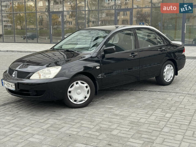 Чорний Міцубісі Lancer, об'ємом двигуна 1.58 л та пробігом 128 тис. км за 5999 $, фото 1 на Automoto.ua