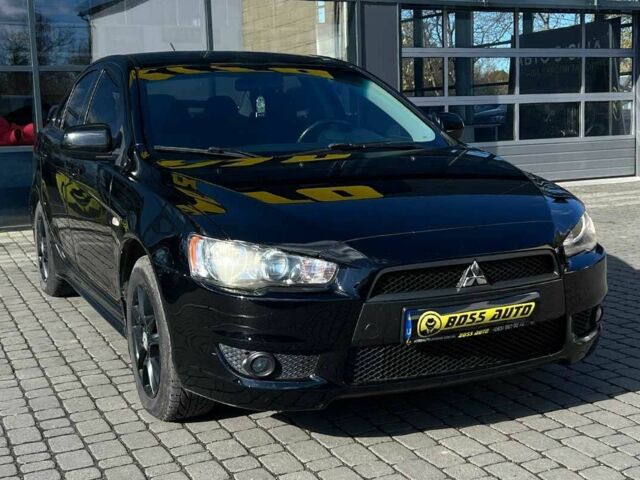 Черный Мицубиси Лансер, объемом двигателя 2 л и пробегом 215 тыс. км за 7000 $, фото 1 на Automoto.ua