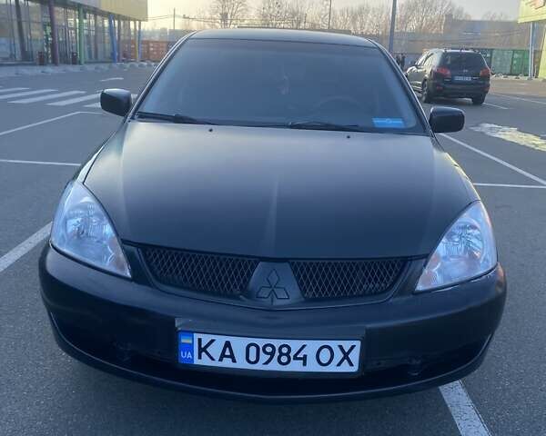 Чорний Міцубісі Lancer, об'ємом двигуна 1.58 л та пробігом 133 тис. км за 4200 $, фото 1 на Automoto.ua