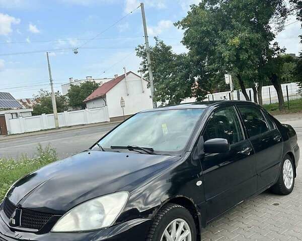 Чорний Міцубісі Lancer, об'ємом двигуна 1.6 л та пробігом 220 тис. км за 3000 $, фото 1 на Automoto.ua