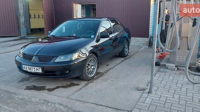 Чорний Міцубісі Lancer, об'ємом двигуна 1.58 л та пробігом 345 тис. км за 4500 $, фото 1 на Automoto.ua