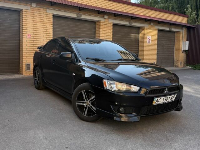 Чорний Міцубісі Lancer, об'ємом двигуна 2 л та пробігом 209 тис. км за 7600 $, фото 1 на Automoto.ua